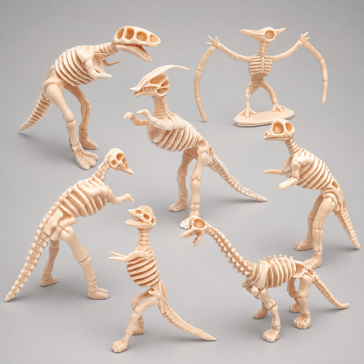 Mini dinosaur skeleton figures in fossil-bone style