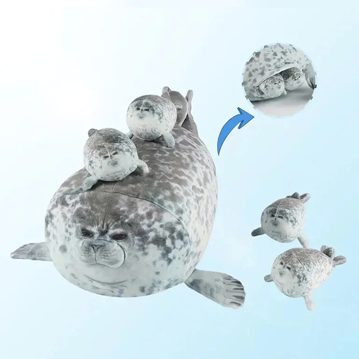 Baby seals coming out of the zipper pouch in the mama seal plush belly